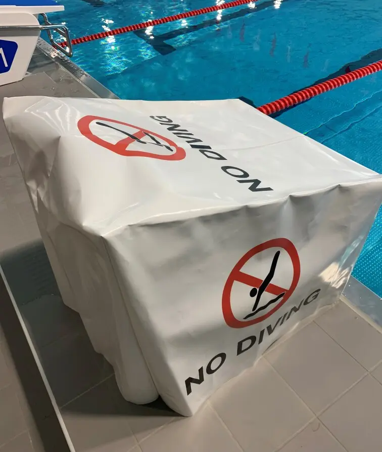 Suojapeite | Lähtötelineille Tekstillä: No diving 